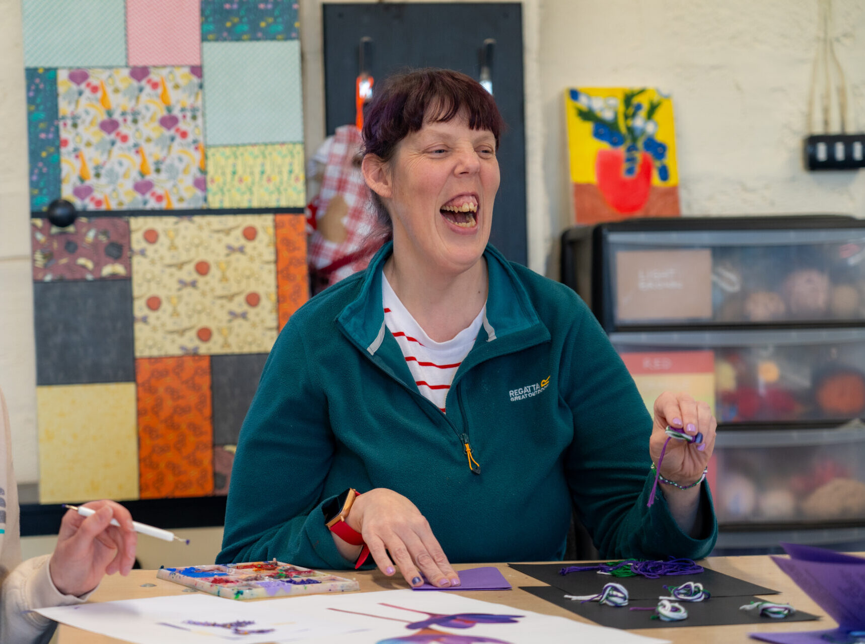 Photo of a woman attending a creative arts service for people with learning disabilities and autism.