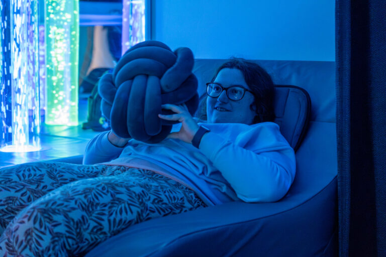 A woman in glasses reclining