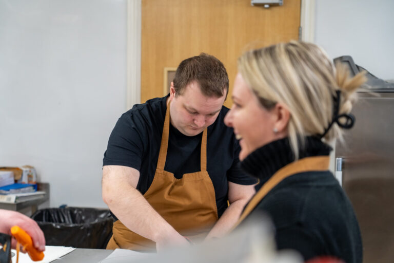 a man and woman in aprons preparing in Roccoco