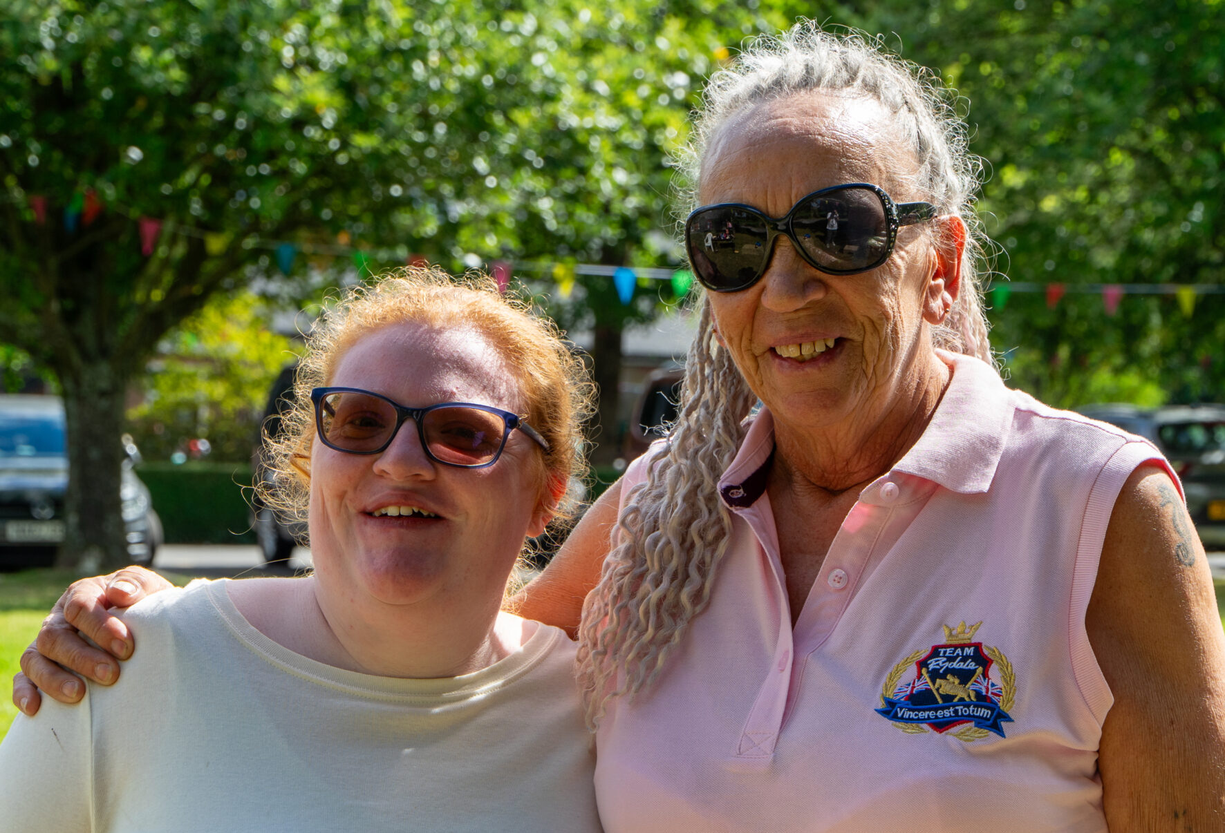 two women smiling on a sunny day