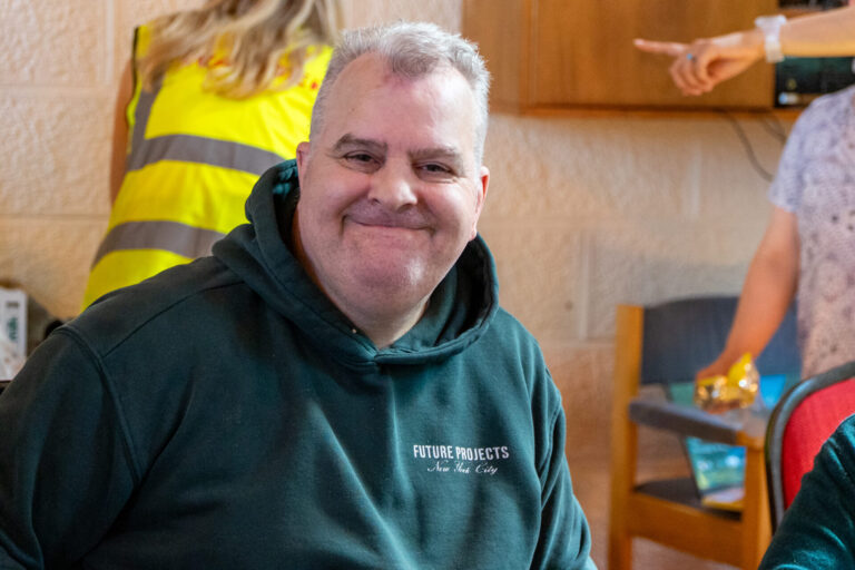 a man smiling at camera